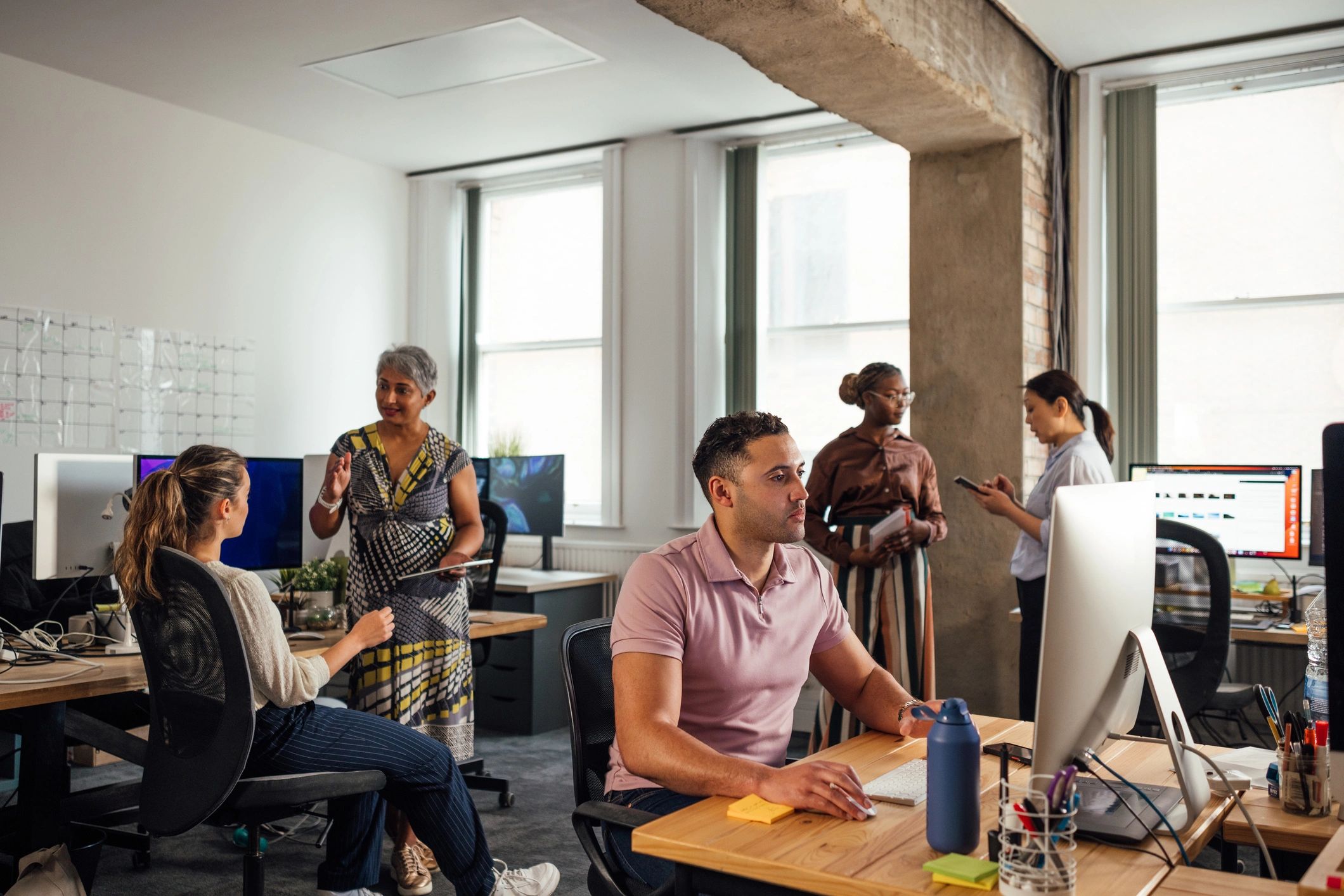 Software development team collaborating in a modern office